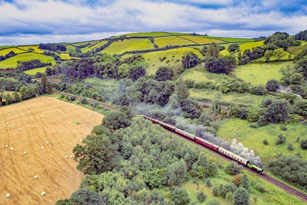 steam engine operating on the gwili railway on a bright summer day