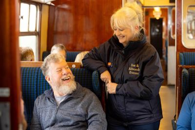 A friendly staff member chatting to a customer