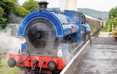 A blue steam train