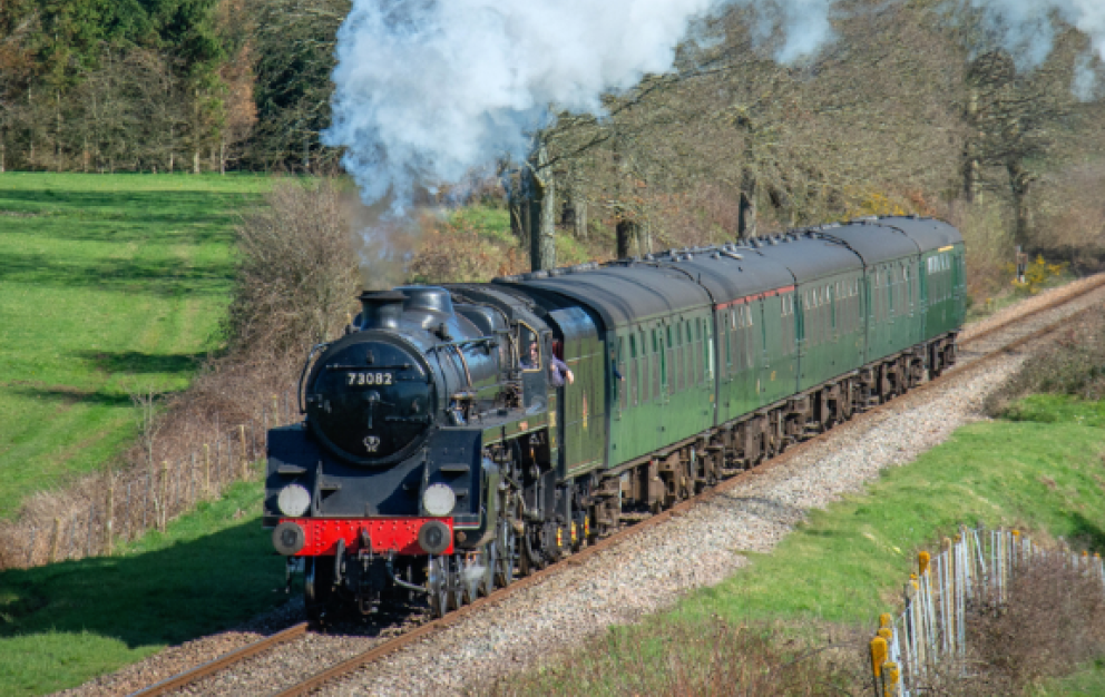 A green steam train
