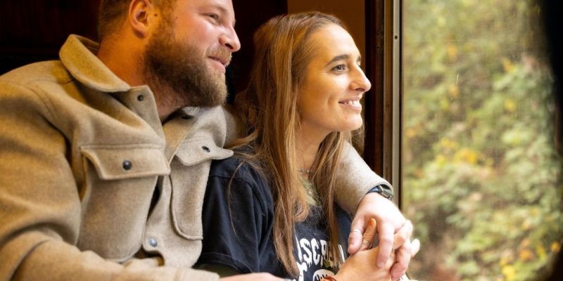 Couple enjoying the view out of the train window