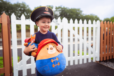 Boy with Paddington doll