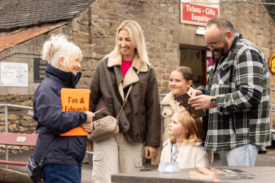 Family waiting on a platform for a train