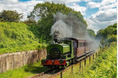 Stanley locomotive operating on the Tanfield Railway with wooden coaches.